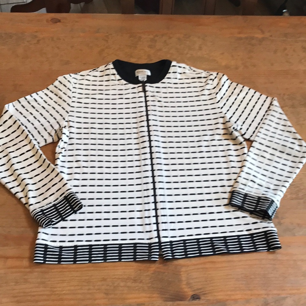 Chico’s travelers size 1 zip front top, worn alone or as a warm up. Round neck.